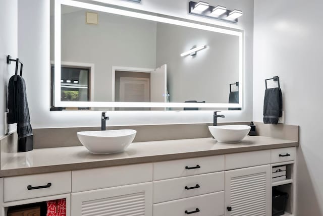 bathroom with double vanity and a sink