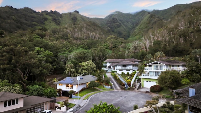 bird's eye view featuring a wooded view and a mountain view