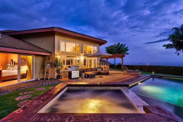 view of swimming pool featuring an outdoor hangout area, a grill, and a patio