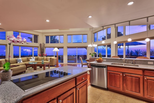 kitchen with decorative light fixtures, black electric stovetop, dishwasher, sink, and light tile flooring