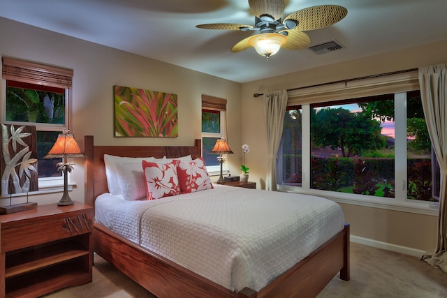 carpeted bedroom with ceiling fan