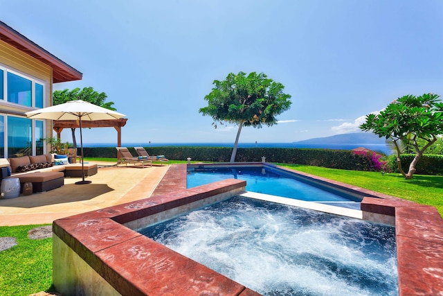 view of pool with a patio, an in ground hot tub, and a yard