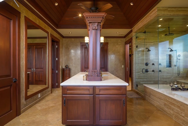 full bathroom featuring decorative columns, a shower stall, vanity, a ceiling fan, and tiled bath