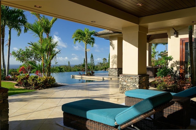 view of patio with a water view