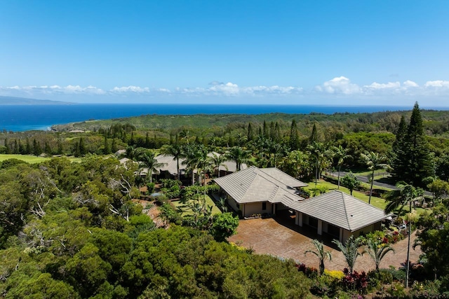 view from above of property with a heavily wooded area