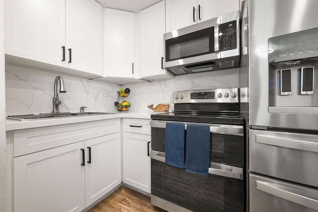 kitchen featuring sink, white cabinetry, and stainless steel appliances