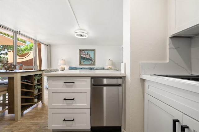 kitchen with white cabinetry and light hardwood / wood-style flooring