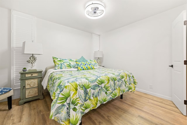 bedroom with hardwood / wood-style flooring