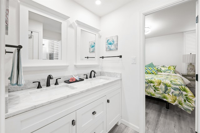 bathroom featuring vanity and hardwood / wood-style flooring