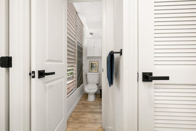 bathroom featuring toilet and hardwood / wood-style floors