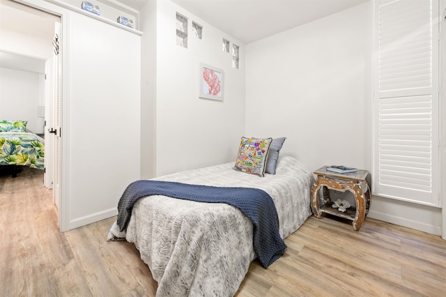 bedroom featuring light wood-type flooring