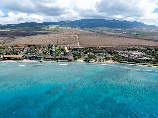 aerial view featuring a water and mountain view