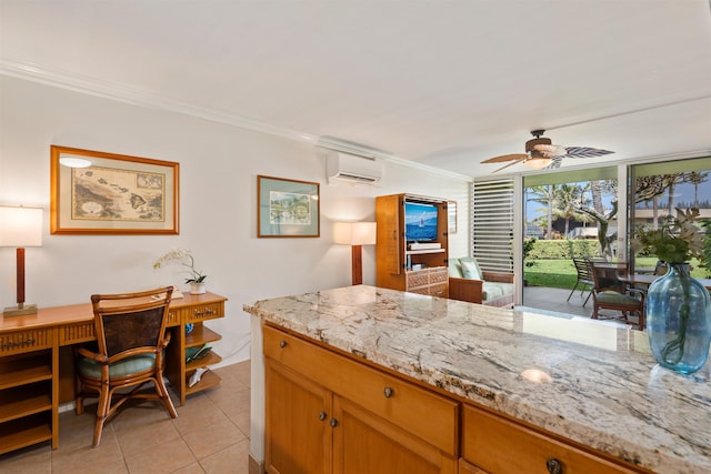 kitchen featuring light tile patterned flooring, a wall mounted air conditioner, crown molding, and light stone countertops