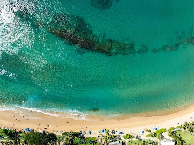 birds eye view of property with a view of the beach and a water view