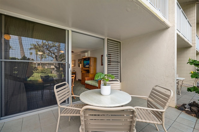 view of patio / terrace with a wall mounted AC