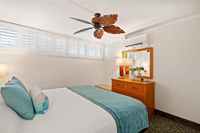 bedroom featuring ceiling fan, baseboards, crown molding, and a wall mounted air conditioner