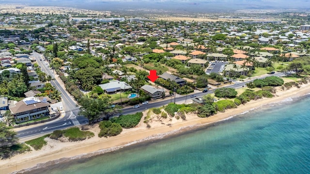 drone / aerial view with a water view and a view of the beach