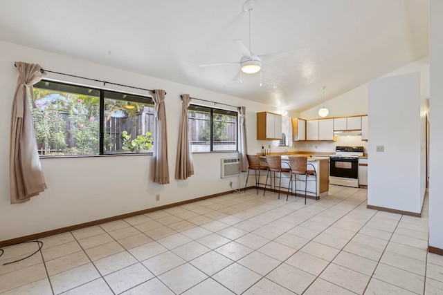 kitchen with lofted ceiling, kitchen peninsula, white cabinetry, range with electric stovetop, and light tile patterned floors