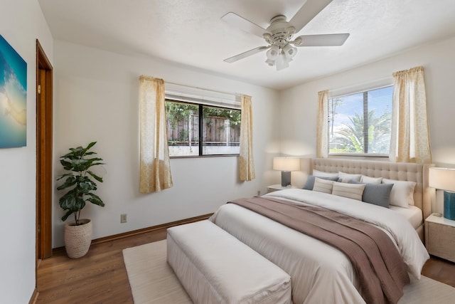 bedroom featuring ceiling fan and hardwood / wood-style floors