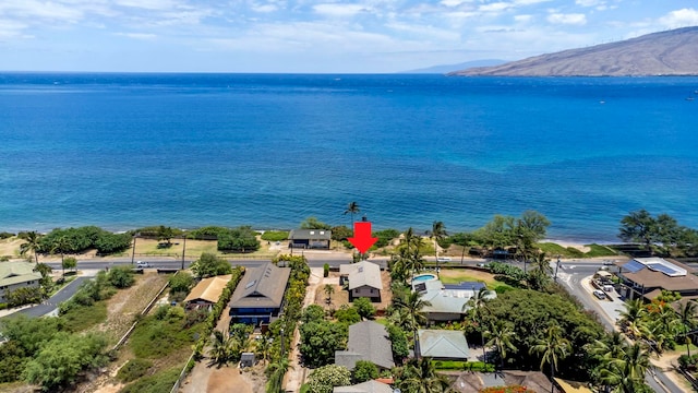 birds eye view of property featuring a water and mountain view