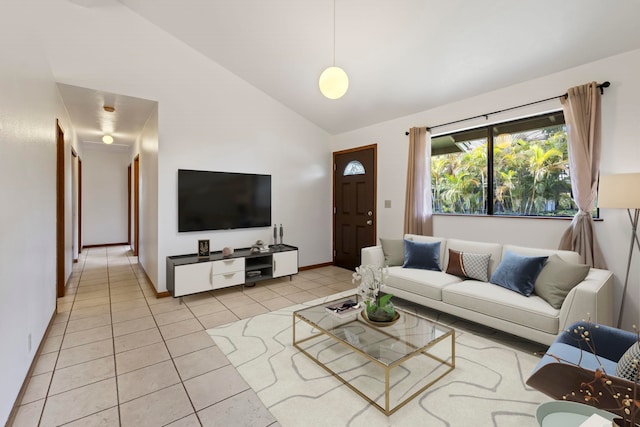 tiled living room with high vaulted ceiling