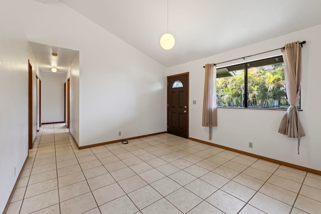 tiled foyer entrance with lofted ceiling