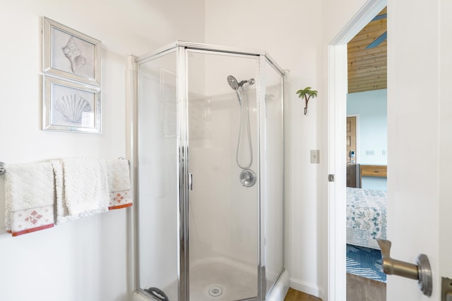 563 Mikioi Pl, Kihei, HI 96753 - bathroom with a stall shower, ensuite bathroom, and wood finished floors