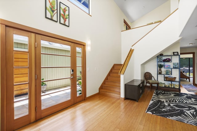 563 Mikioi Pl, Kihei, HI 96753 - foyer with stairs, french doors, wood-type flooring, a high ceiling, and plenty of natural light
