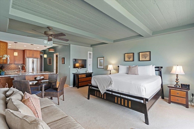 bedroom featuring stainless steel fridge, light colored carpet, ceiling fan, sink, and beamed ceiling