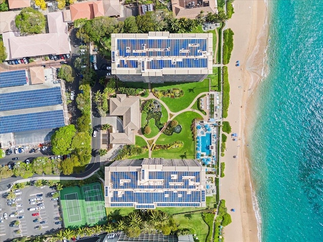 bird's eye view with a water view and a beach view