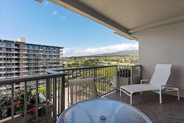 balcony featuring a mountain view