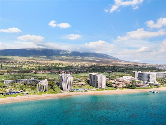 birds eye view of property with a beach view and a water and mountain view