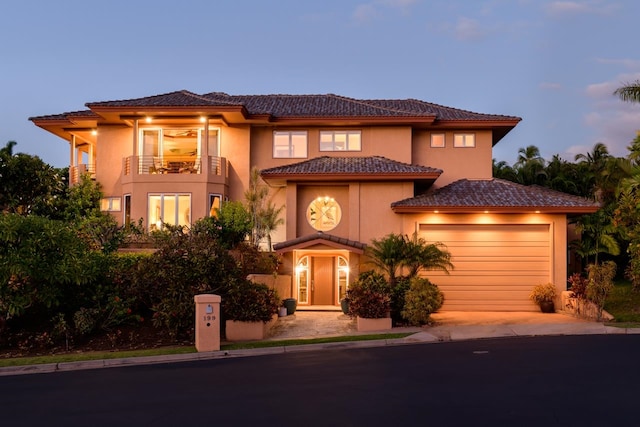 mediterranean / spanish house featuring a balcony