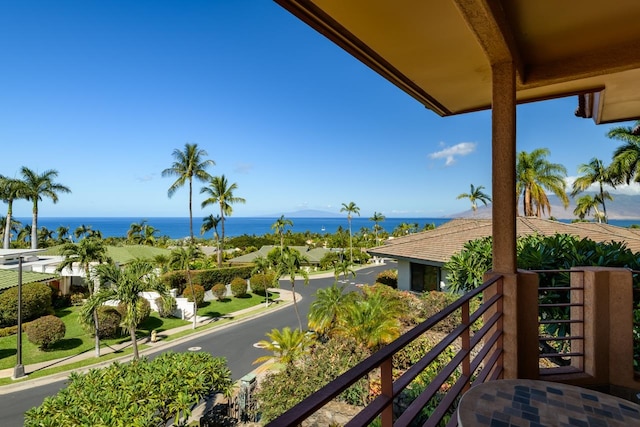 balcony featuring a water view