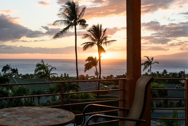 balcony at dusk with a water view