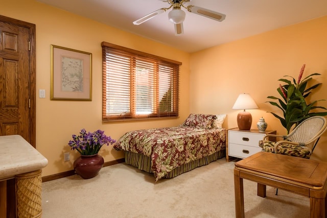 bedroom with light colored carpet and ceiling fan