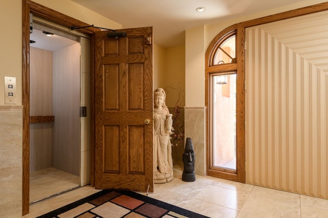 foyer entrance featuring light tile floors