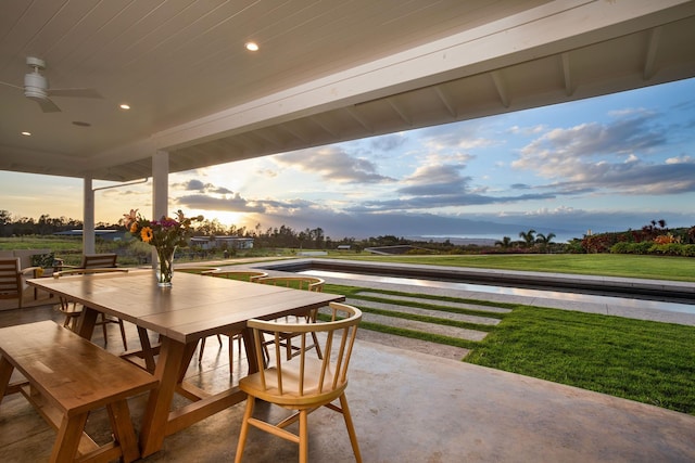 patio terrace at dusk with ceiling fan