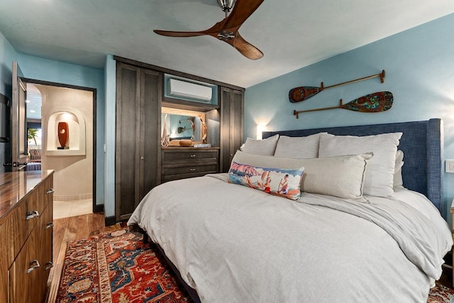 12 S Kihei Rd Unit E2, Kihei, HI 96753 - bedroom with wood finished floors and a ceiling fan