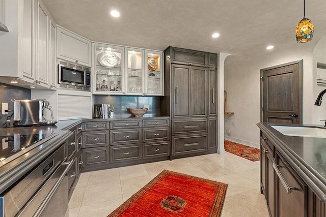 12 S Kihei Rd Unit E2, Kihei, HI 96753 - kitchen featuring appliances with stainless steel finishes, white cabinets, light tile patterned floors, recessed lighting, and decorative light fixtures