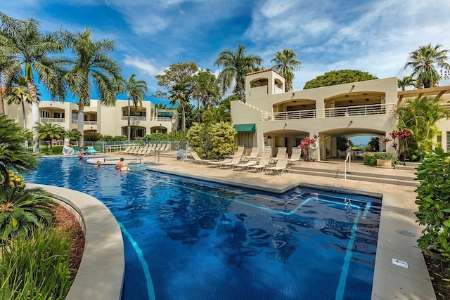 view of swimming pool with a patio