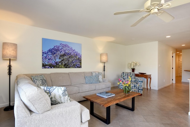 living room featuring light tile patterned floors and ceiling fan