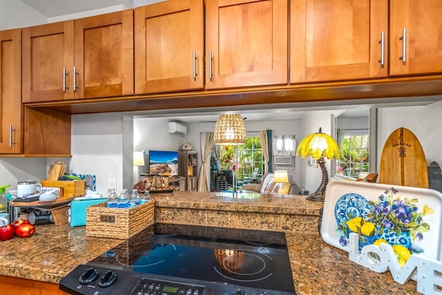 kitchen featuring stove and an AC wall unit