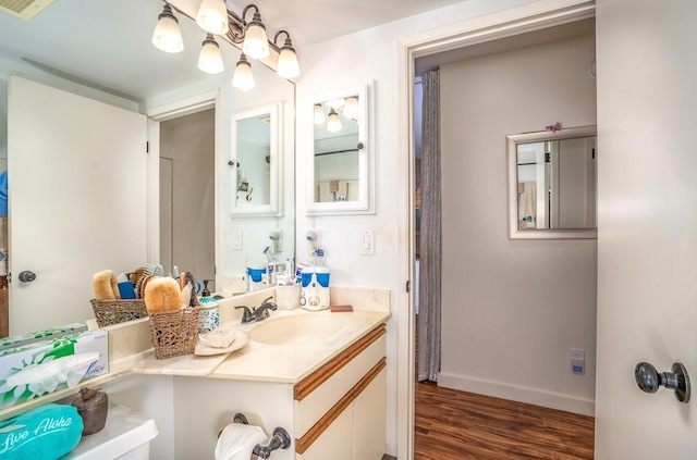 bathroom featuring vanity and hardwood / wood-style flooring