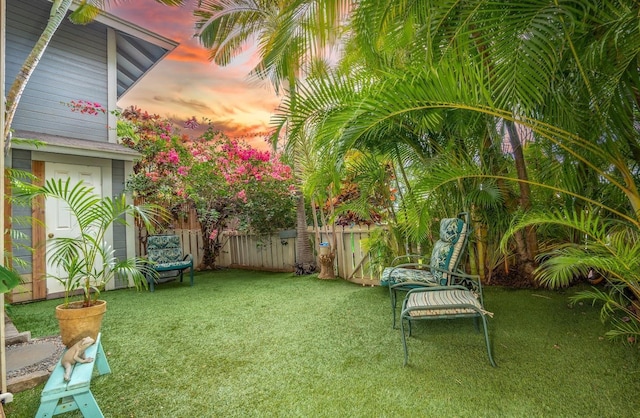 view of yard at dusk