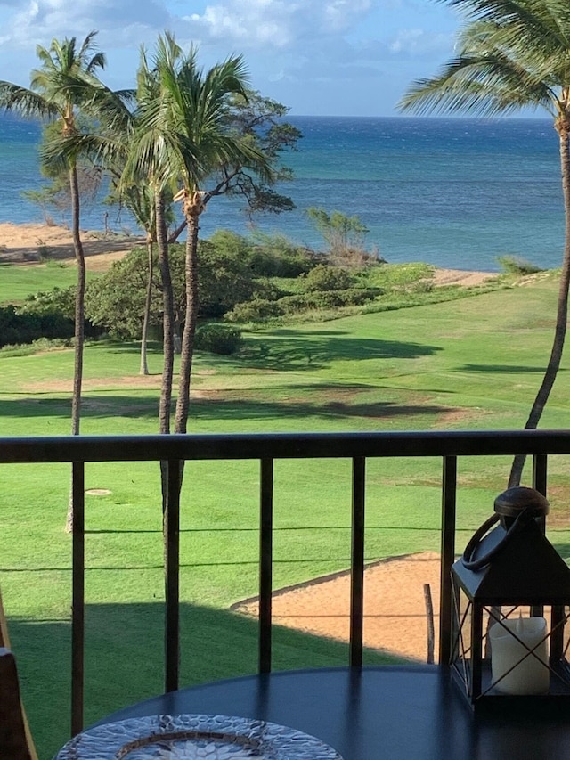 balcony featuring a water view