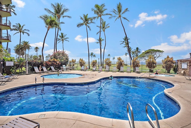 view of swimming pool with a patio