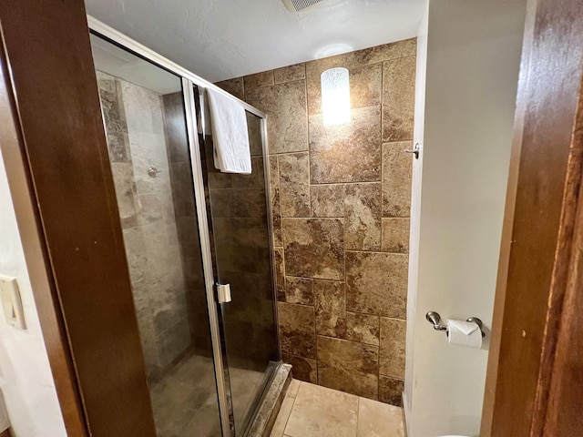 bathroom featuring a shower stall