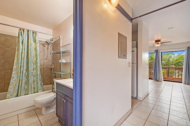 full bathroom with shower / bath combo with shower curtain, toilet, tile patterned floors, and vanity