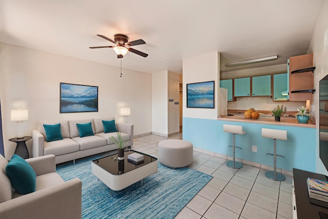 tiled living room featuring ceiling fan